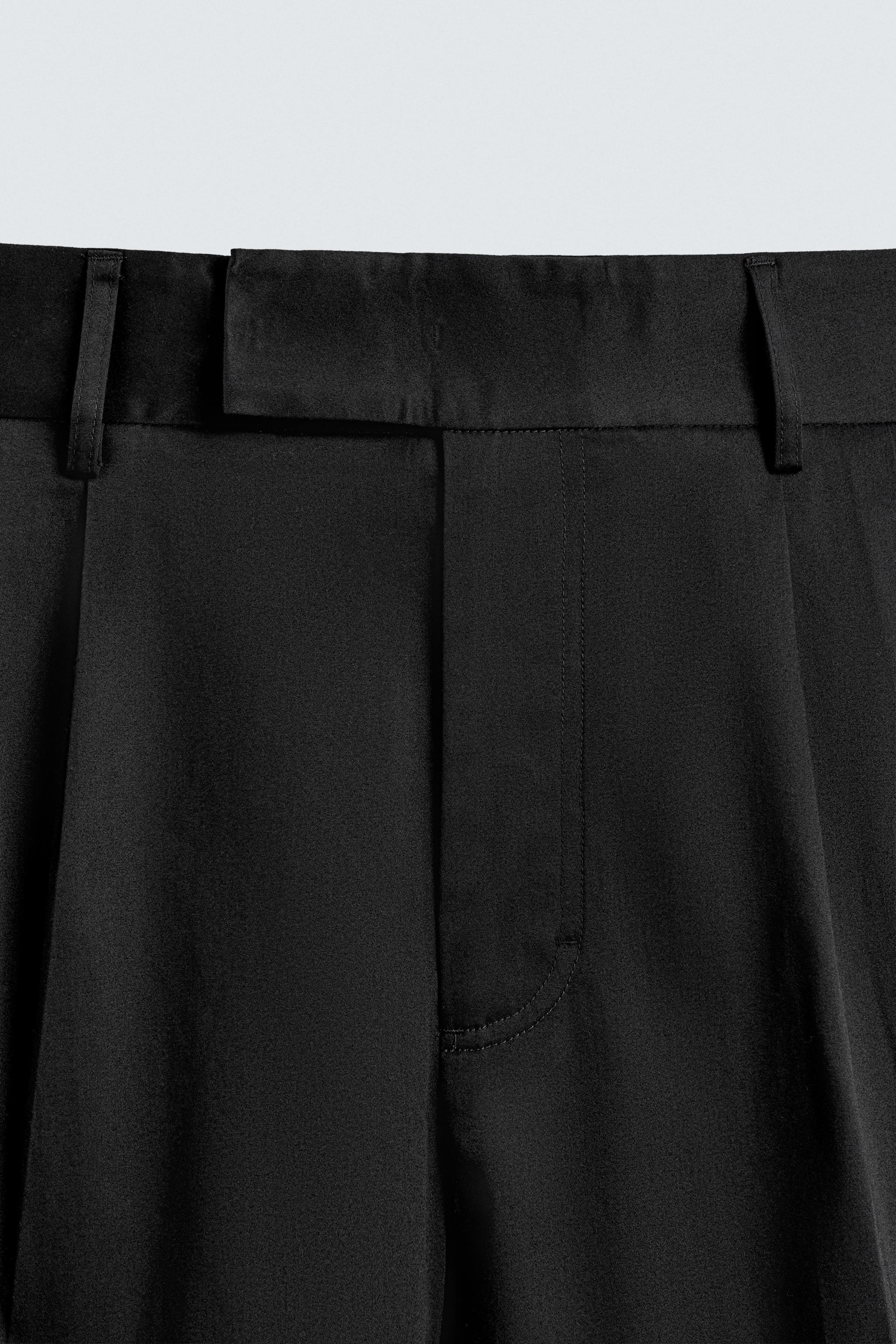 RELAXED FIT PLEATED PANTS